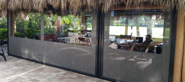 Clear Vinyl Motorized Patio Enclosure deployed outside patio restaurant