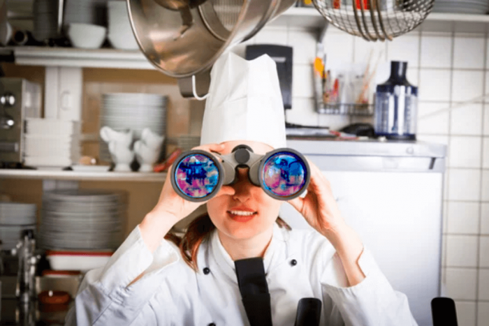 female chef restaurant after covid binoculars